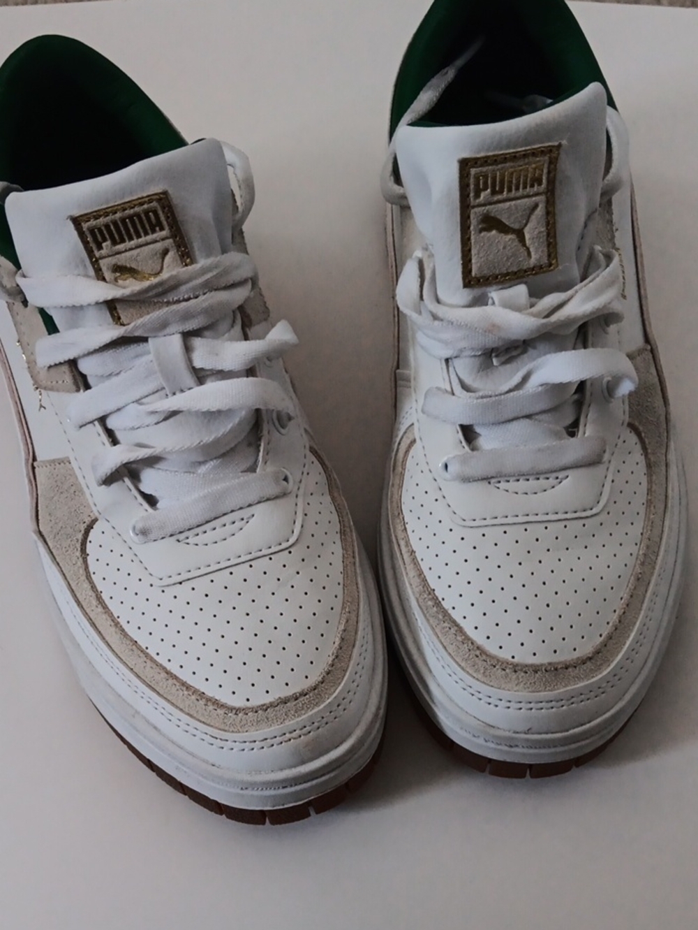 Puma White Sneakers with Green Lining and Gold Accents